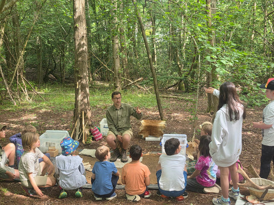 Flint knapping demo at Archaeodiscovery DIG SCHOOL - hands on archaeology for kids